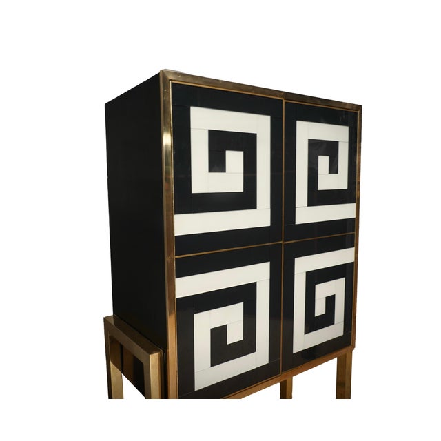 Glass Cabinet with Optical Effect in black and white, a masterpiece of modern craftsmanship that combines the timeless...