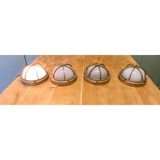 Set of 4 Vintage Style Nautical Brass Wall Lights The Lamps are made in brass with opaque glass shades they are fully...