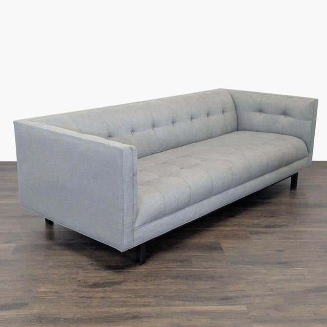This Restoration Hardware 3-seat sofa features a sleek, modern design with a light gray fabric finish. The clean lines and...