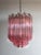 Trio Murano chandelier made by 47 Murano pink crystal prism "quadriedri" in a nickel metal frame. The glass are in 2...