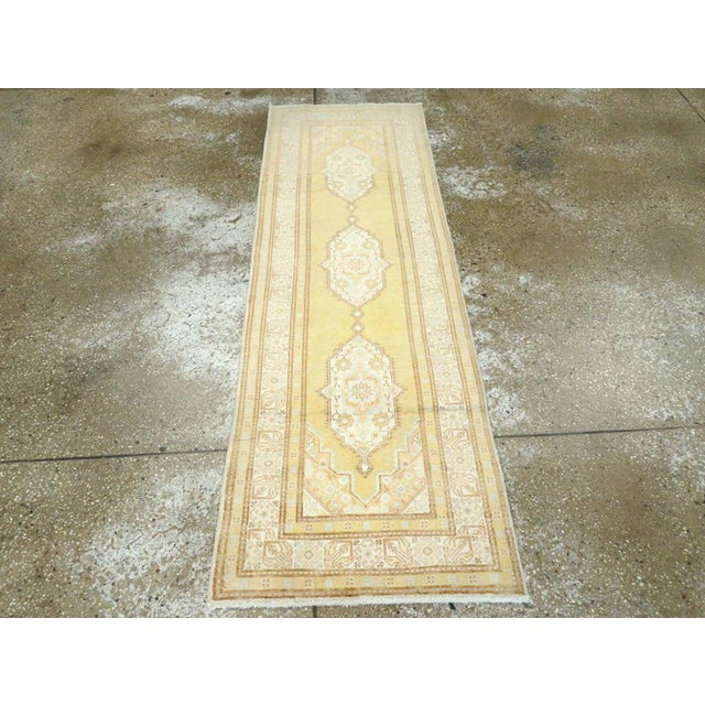 A vintage Turkish Sivas runner. Sivas rugs often follow Tabriz protocols and the lemon yellow field with three linked...