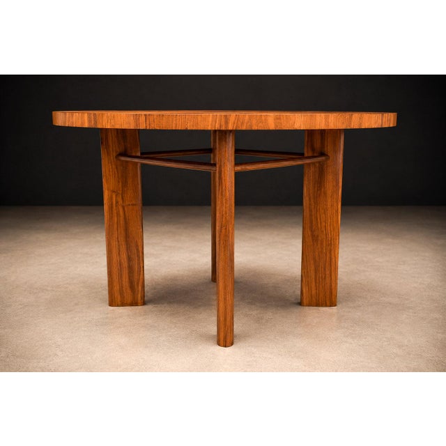 Designed in the 1950s by Joaquim Tenreiro, this exceptional round dining table represents a mature expression of Brazilian...
