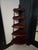 A beautifully crafted vintage mahogany corner whatnot shelf, standing 54.5 inches tall and showcasing classic carved...