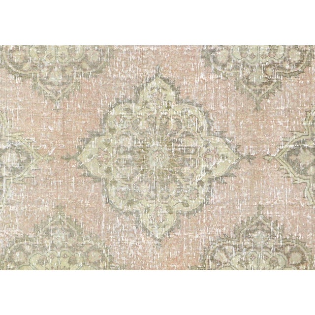 Hand-woven wool on wool foundation in Turkey's Oushak region, this 4'10" x 11'8"&nbsp;vintage rug exemplifies authentic...