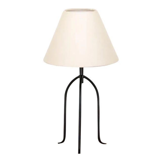 Large iron tripod lamp with slender legs and tapered feet. New wiring and new linen shade. Sold individually and newly...