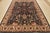 A traditional Heriz rug hand-knotted with an all-wool pile on a cotton foundation. This oriental rug features an all-over...