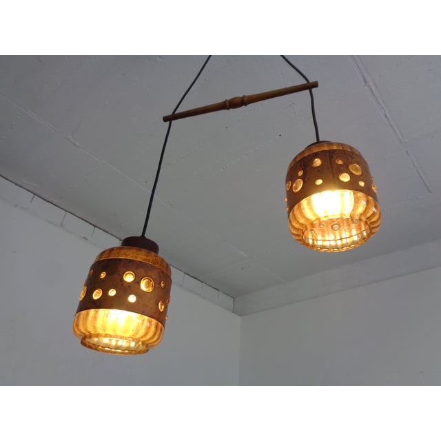 Ceiling lamp with two copper and glass light fixtures by Nanny Still for Raak from the 1960s. Diameter of the light...