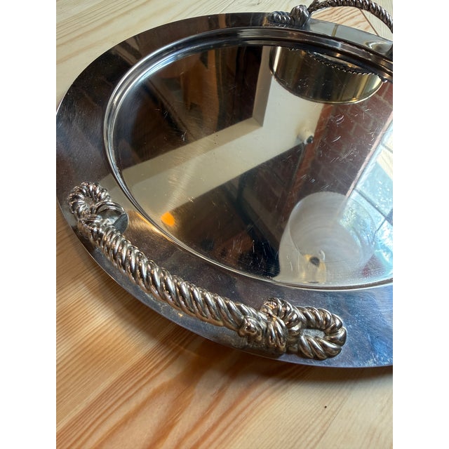 Elegant Italian mid-century oval serving tray crafted in the 1970s, featuring a polished silver-plated surface accented by...
