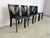 Vintage black leather dining chairs made in italy. Good overall condition with normal age related wear In the style of...