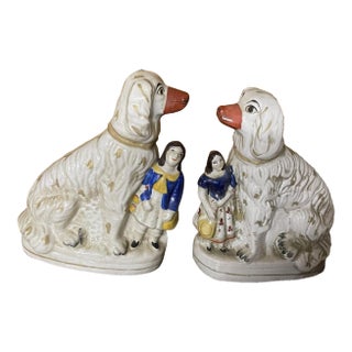 One Pair of Antique Staffordshire Dogs With Children For Sale