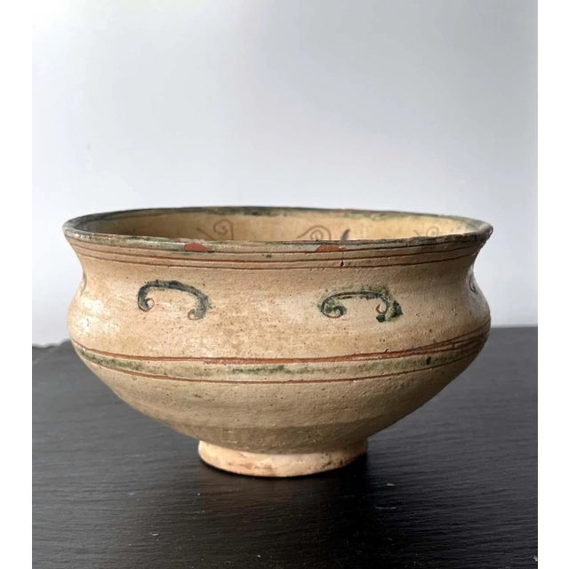 A small Islamic ceramic bowl circa 11-12th century, possibly from Aghkand Persia. The elegantly shaped bowl with a...