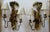 Pair of antique polychrome hand-carved wood and iron monkey wall sconces from the early 20th century. The multicolor...