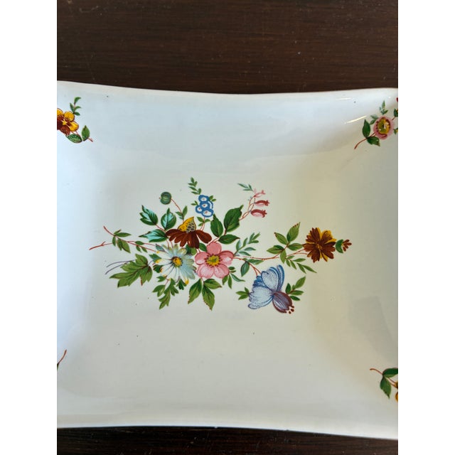 This charming vintage finds porcelain tray features a vibrant hand-painted central bouquet of wildflowers. Dainty floral...