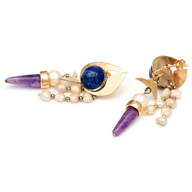 The sterling silver dangle earrings from Replacements Ltd. come to you from our Estate Jewelry Collection. These earrings...