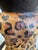 Whimsical and sculptural double-arm table lamp signed by Bill Huebbe , featuring a stylized monkey figure dressed in a...
