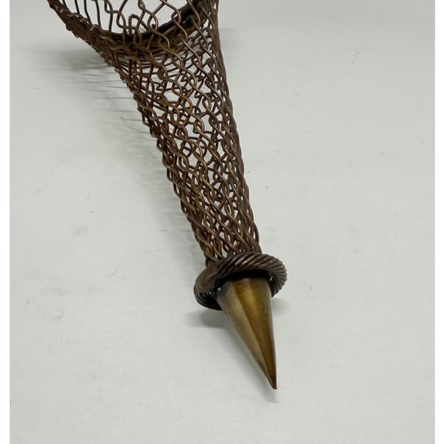 An unusual and finely executed hand-wrought bronze wire wall pocket or bouquet holder, dating to the late 19th or early...