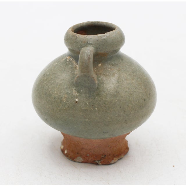 15th century Thai Sawankhalok celadon glazed pottery jarlet. Red pottery. Loop handles. Nibbles on base but exceptional...