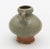 15th century Thai Sawankhalok celadon glazed pottery jarlet. Red pottery. Loop handles. Nibbles on base but exceptional...