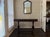 A handsome vintage Jacobean Revival draw-leaf table featuring beautifully turned baluster legs, carved stretcher base, and...