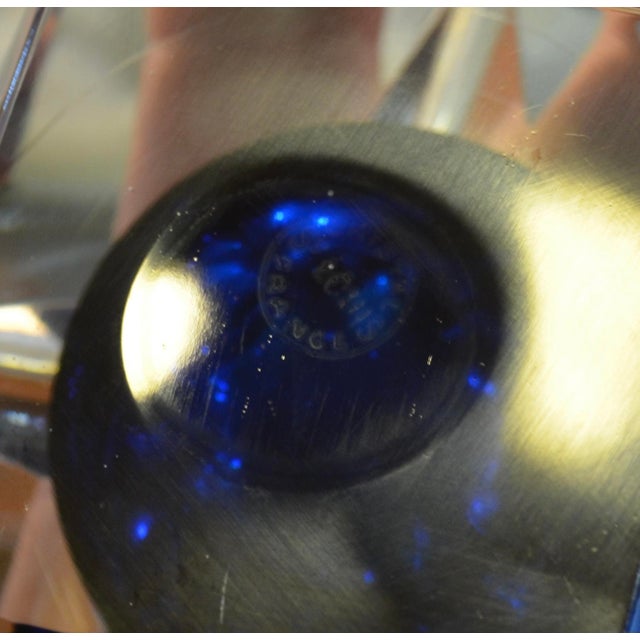 Striking French crystal ashtray by Saint-Louis, distinguished by its sculptural, faceted form and deep cobalt blue central...