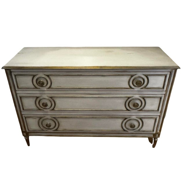 Elegant three-drawer dresser by John-Richard featuring a hand-painted finish with gilded detailing and circular...