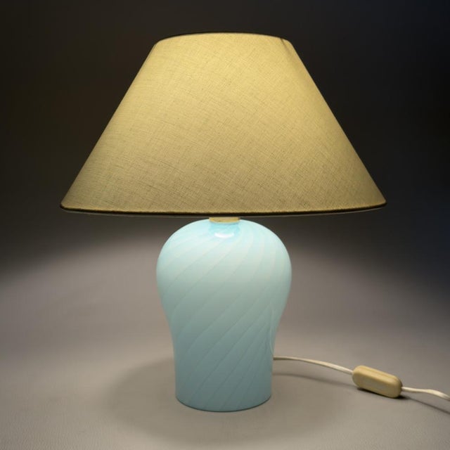 A refined vintage Italian table lamp dating back to the 1970s. The Davinci brand is printed on the protective felt at the...