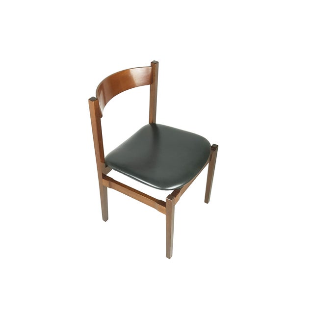 Set of 6 dining chairs designed by Gianfranco Frattini for Cassina in the '60s. Walnut structure with black skai seat....