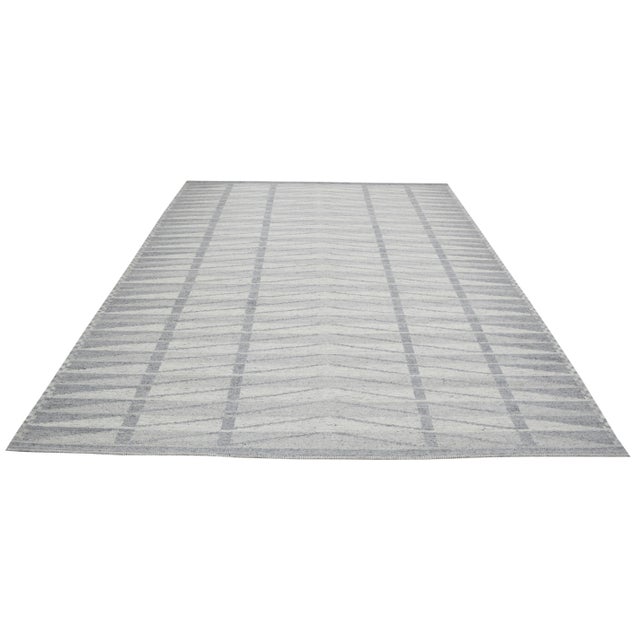 Contemporary Scandinavian wool flatweave rug with soft wool texture.