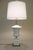 A bold and impressive stylized Neoclassical Modern Bisque, Marble & Brass table lamp designed and manufactured by Paul...