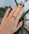 A 1.4-carat padparadscha sapphire glows in its signature pink-orange at the centre of this solid 14K yellow gold ring,...
