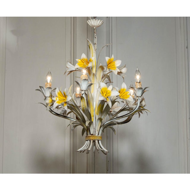 Stunning Italian metal floral chandelier with beautiful large lely's . The metal is lacquered in white and yellow. It is...