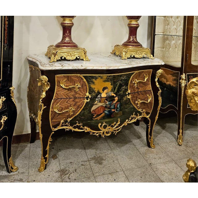 A stunning Louis XV style commode chest that combines fine craftsmanship, artistic elegance, and functional storage. This...