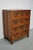 This apothecary / filing cabinet was produced during the 1930s in Indonesia. This piece features 12 drawers with brass /...