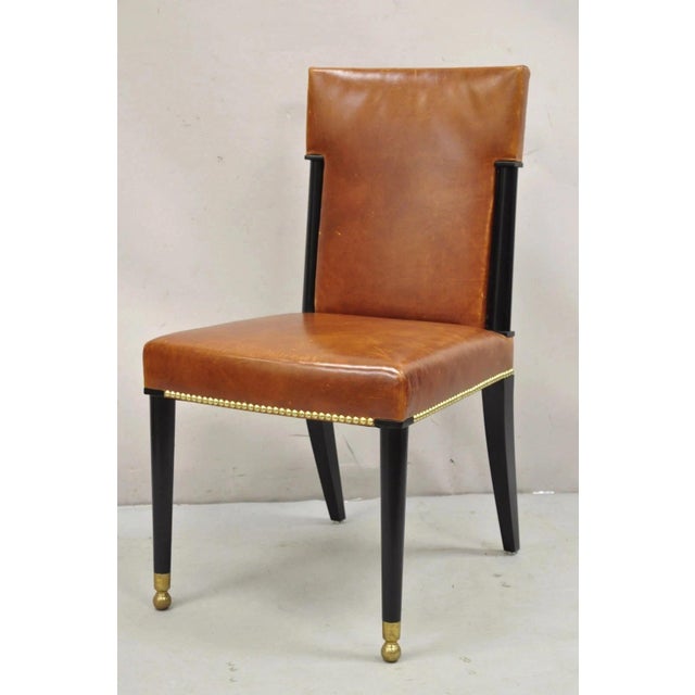 French Art Deco Style Brown Leather Ebonized Frame Dining Chairs - Set of 8. Chairs feature remarkable quality and...