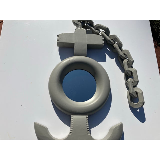 This hand carved wooden mirror is painted a mellow fog gray The chain is also carved wood Mirror is in great Chain length...