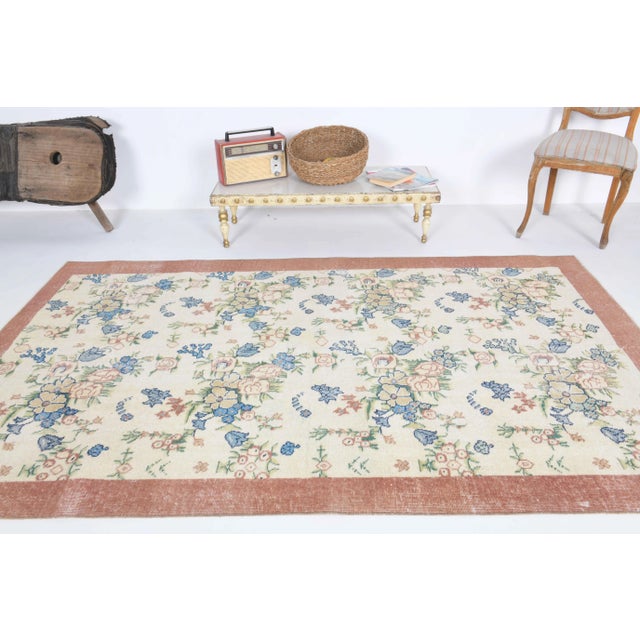 Vintage Turkish Hand-Knotted vintage rug is a semi-Vintage area rug.'70s Eastern region of Turkey's unique rug is...