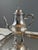 An elegant silver-plated tea and coffee service comprising two teapots/coffee pots, a covered sugar bowl, a milk jug, and...