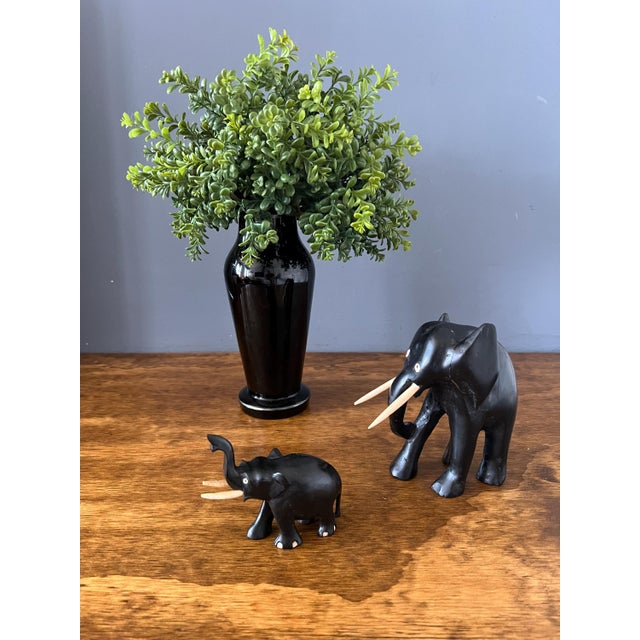 Set of two vintage hand carved ebony elephant. Elephant mom with calf figurines. It is very rare to find them with the...