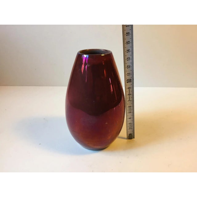 This is a unique vase in Deep Red lustre glaze. Its by a danish ceramist called Øbo who for a period of time worked at...