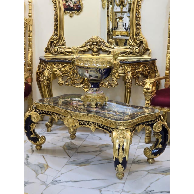 This extraordinary French Rococo style coffee table is a true statement piece, showcasing exceptional craftsmanship,...