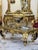 This extraordinary French Rococo style coffee table is a true statement piece, showcasing exceptional craftsmanship,...