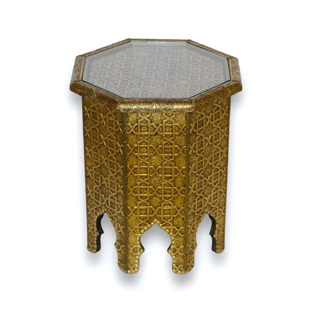 Discover the luxury of Moroccan craftsmanship with our compact golden metal side table, a statement piece adorned with...