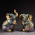 This charming pair of gilt cloisonne enamel elephant figures brings a touch of traditional elegance and prosperity to any...