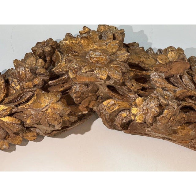 French Carved and Gilded Wood Architectural Ornament or fragment, 18th- 19th c. Exuberantly carved floral swag, with...