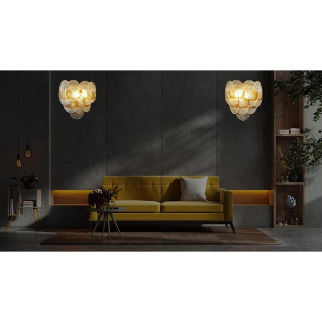 Pair of Italian vintage Murano wall lights made by 10 glass leaves for each applique in golden painted metal frame. The...