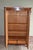 19th century German walnut Art Deco maid's cupboard. The height is 173 cm. The width is 110 cm. The depth is 52 cm....