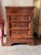 18th century Italian walnut commode of small scale, with a molded top over a slim frieze drawer and three drawers below...
