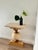 Self made console table with a travertine top and a wooden base which was once a mockup of a table leg, combination of...