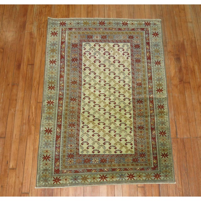 Vintage decorative Shirvan rug woven in the villages and mountains of the Caucasus with blue and red accents on a clear...