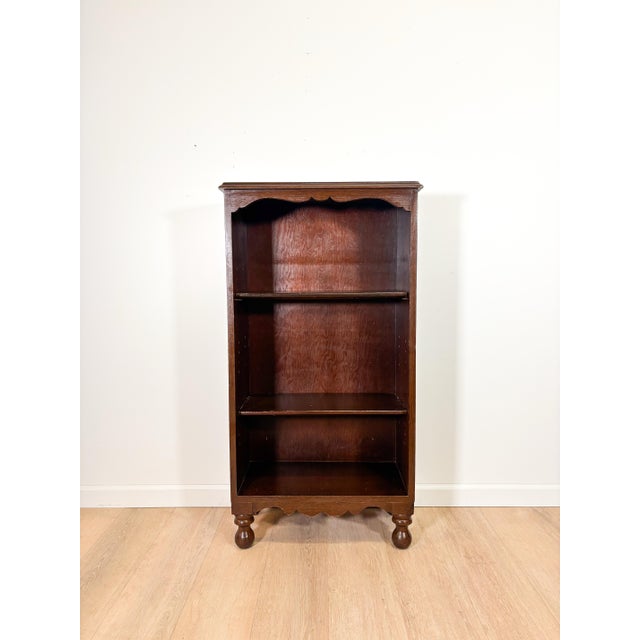 This charming vintage bookcase brings warmth and old world character to a room. Style it with books, plants, and collected...